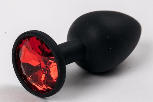 Черная силиконовая анальная пробка с красным стразом - 7,1 см., 4sexdreaM